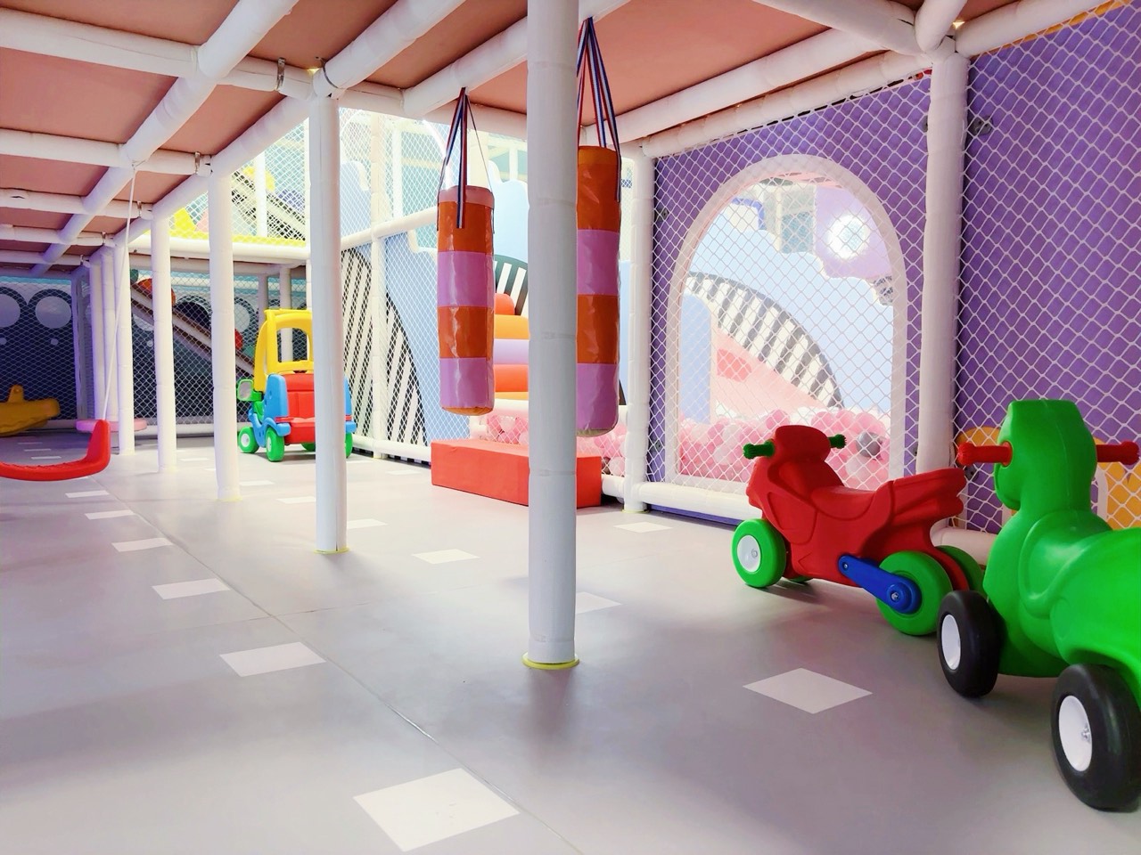 Ride-on toys and soft play area for toddlers