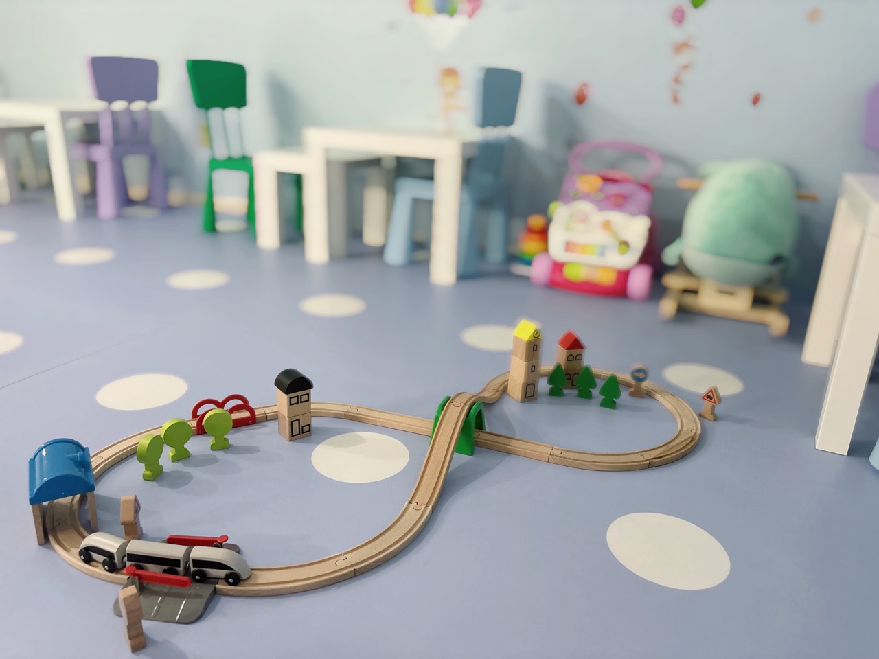 Wooden train table and kid-sized seating